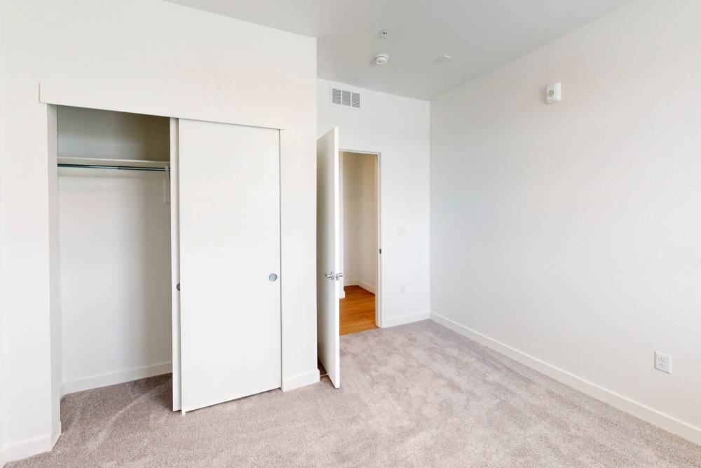 Walk-in closet inside the unfurnished apartment bedroom at The Rose on Colfax in Denver,Colorado