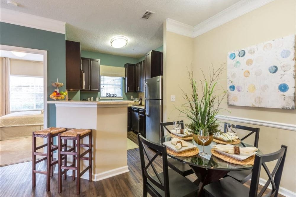 High-end kitchen with white cabinetry and a large adaptable island at Chattahoochee Ridge in Atlanta, Georgia