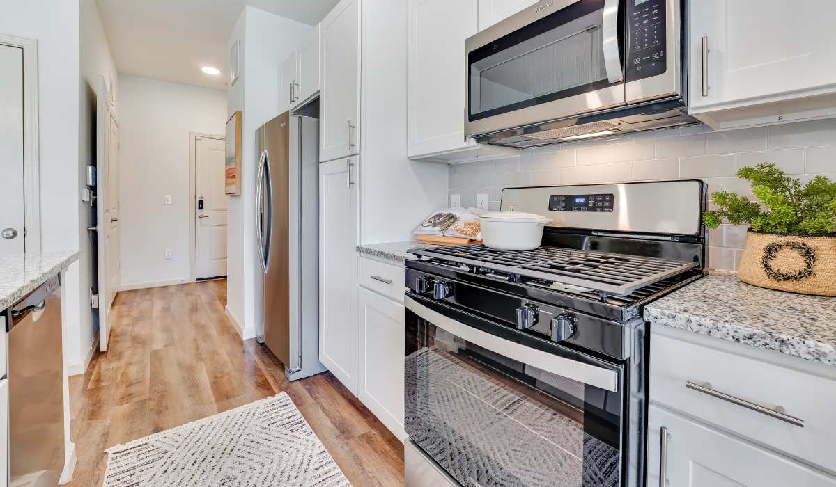 Kitchen with dishwasher and stainless steel appliances at Meridian City Park in Houston, Texas