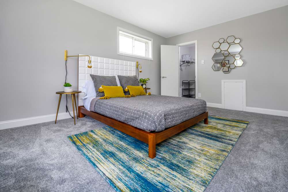 Bedroom with night stand at Beacon Hill Apartments in Alexandria, Virginia