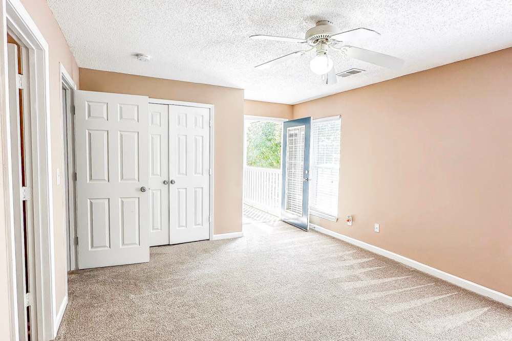 Spacious living room with way out of the apartment at Cushendall Commons in Rock Hill, South Carolina