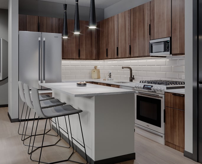 Sleek modern kitchen at Solana Stapleton Apartments in Denver, Colorado