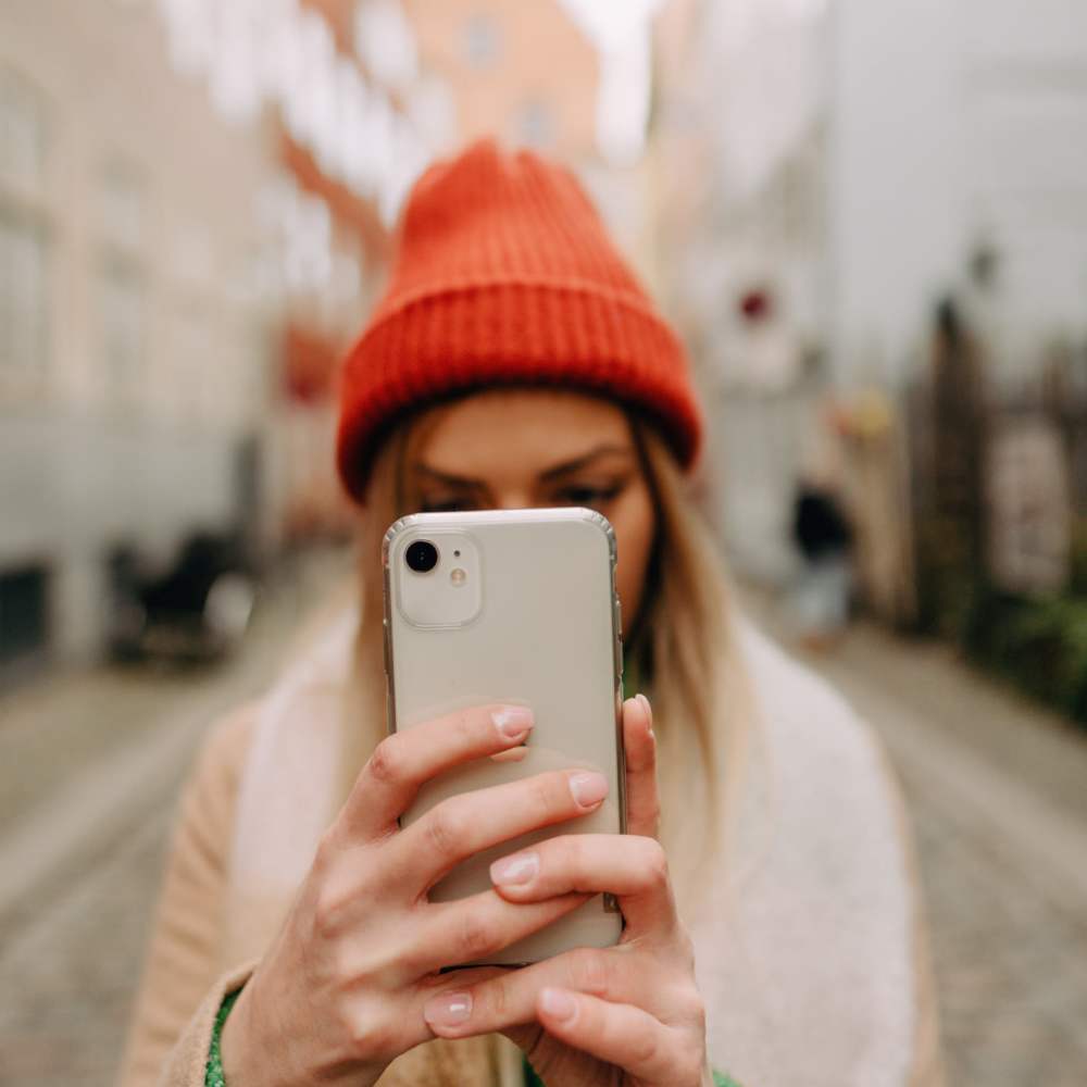 A photo of a girl taking a photo on her phone at The Ivy in Tampa, Florida