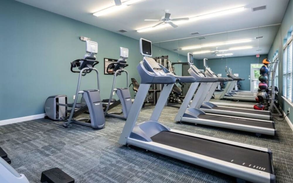 Well-equipped fitness center with cardio equipment at Carden Place Apartment Homes in Mebane, North Carolina