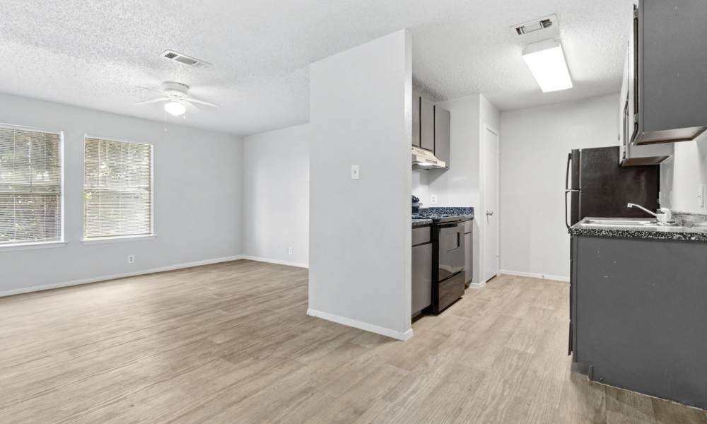 Wood-style flooring in the apartment at Arbors of Taylor in Taylor, Texas