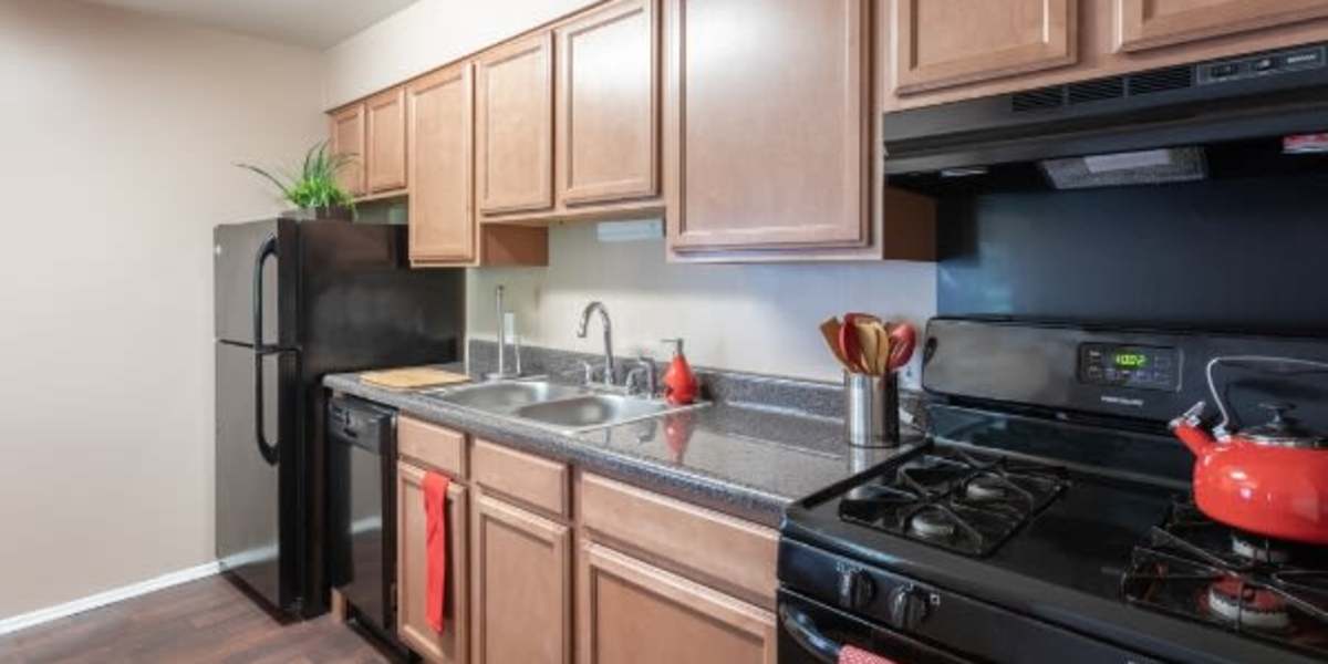 Kitchen with black appliances at Signal Hill in Manassas, Virginia