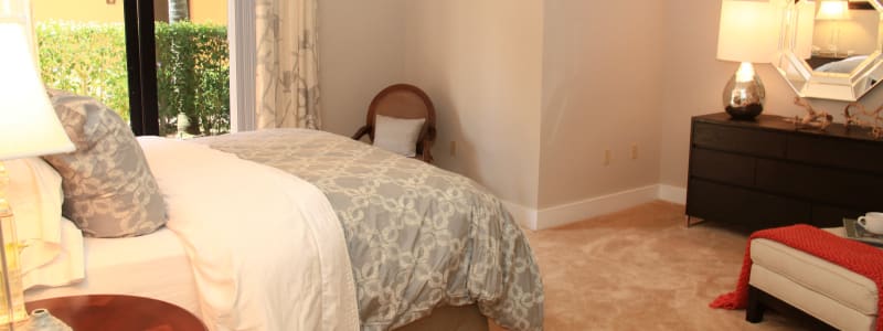 Well decorated bedroom at The Heritage at Boca Raton in Boca Raton, Florida