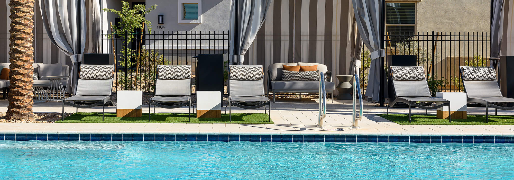 Poolside cabanas and daybeds at Tavalo at Cadence in Mesa, Arizona