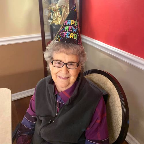 A resident with a birthday hat on at Canoe Brook Assisted Living in Duncan, Oklahoma