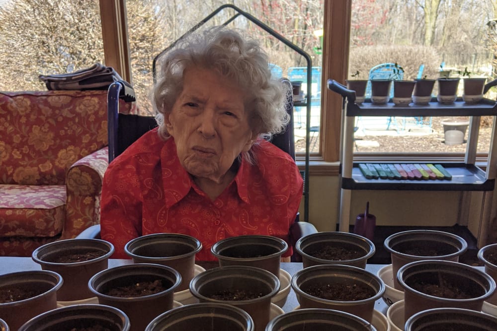 Resident participates in a gardening activity at Ramsey Woods in Cudahy, Wisconsin.