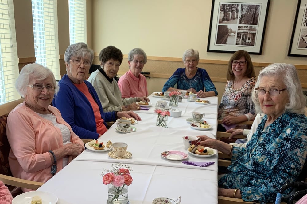 Resident friends enjoying a meal at Merrill Gardens at Willow Glen in San Jose, California. 