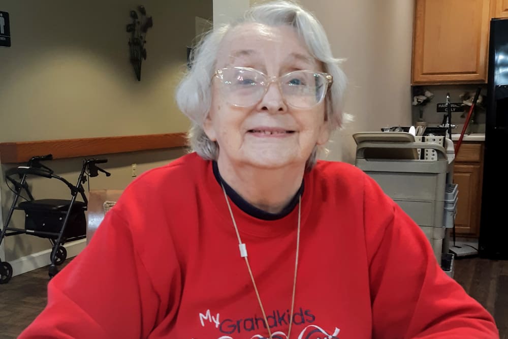 Resident sitting at Brown Deer Place in Coralville, Iowa