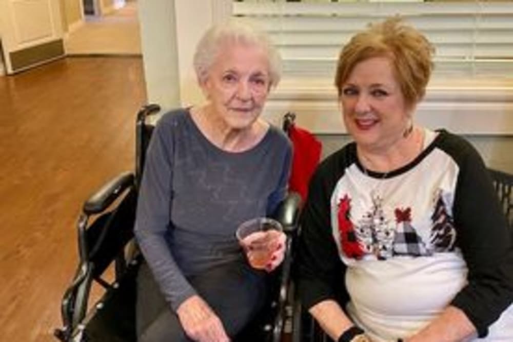 Resident couple sitting in communal lounge area at Shawnee Memory Care in Shawnee, Oklahoma