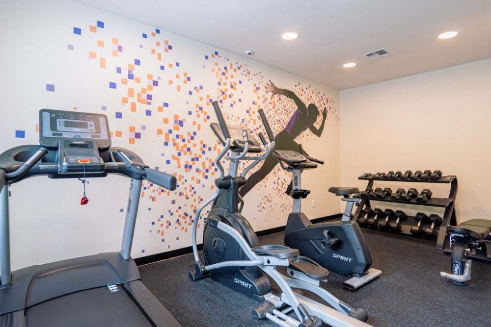 Fitness center with treadmill at Dunwoodie Place in Orlando, Florida