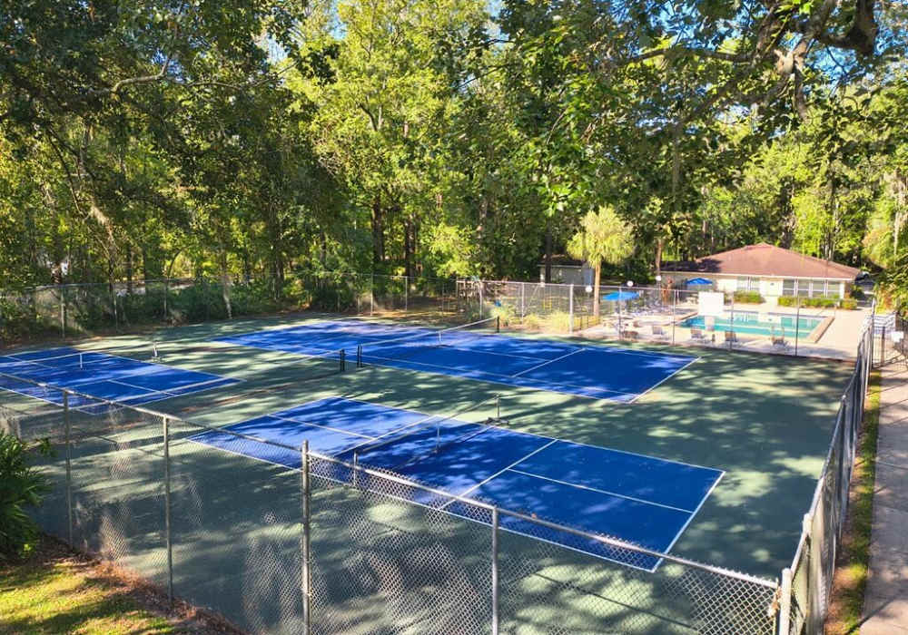 Community tennis court at Creekwood Apartments in Gainesville, Florida