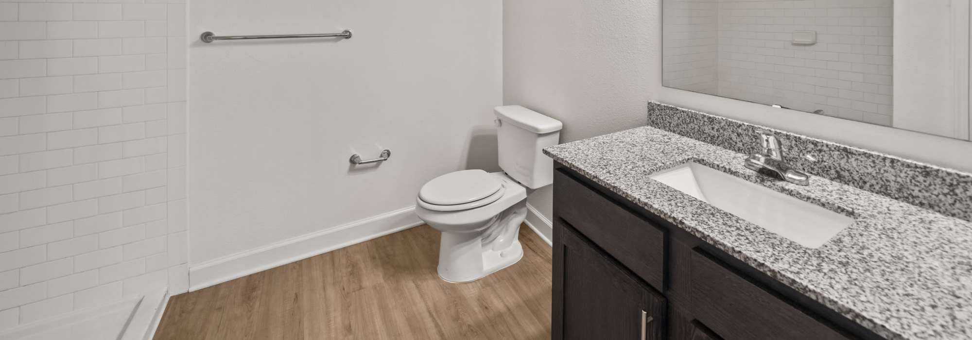 Bright bathroom with pendant lights at Fletcher Black in Panama City, Florida