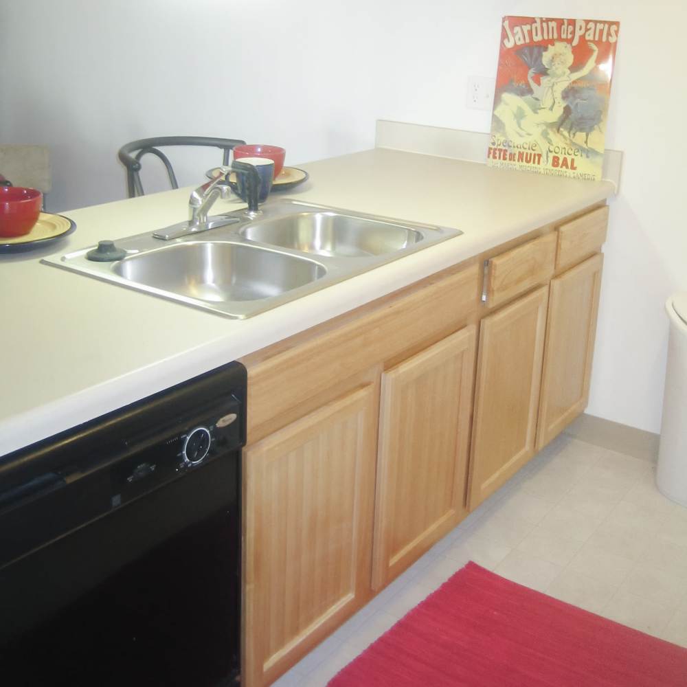 View of apartment kitchen at Maple Heights Apartments in Saline, Michigan