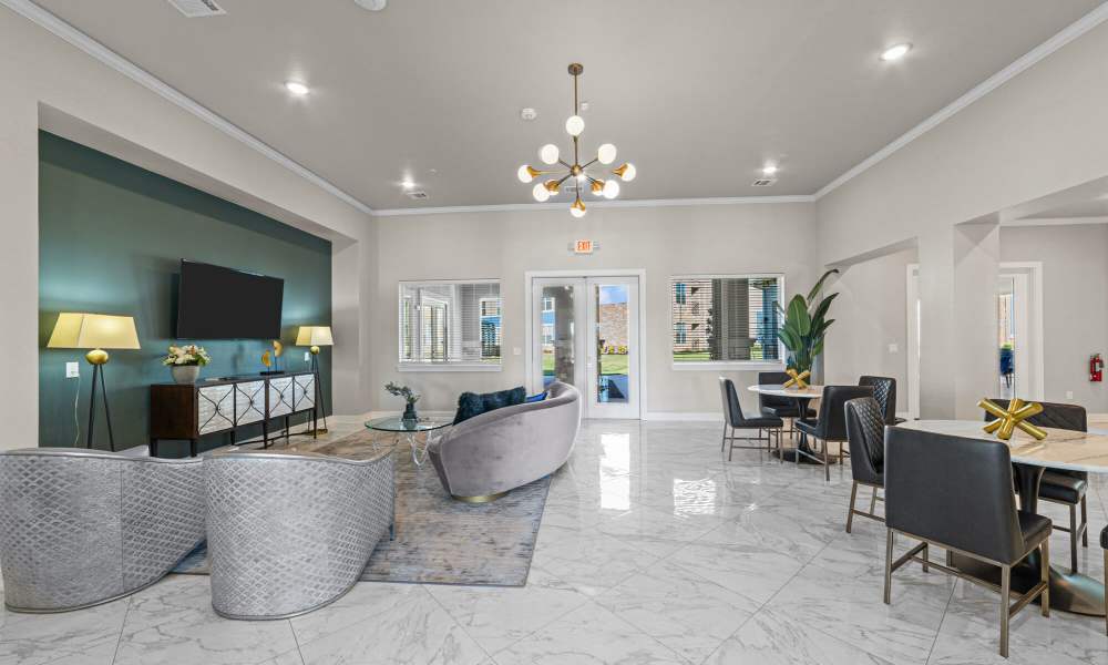Community living area with flat-screen TV at Brook Hollow in Wichita Falls, Texas
