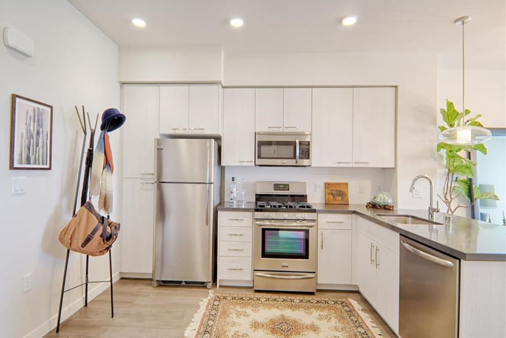 Modern kitchen with wood cabinets at Angelene Apartments in West Hollywood, California