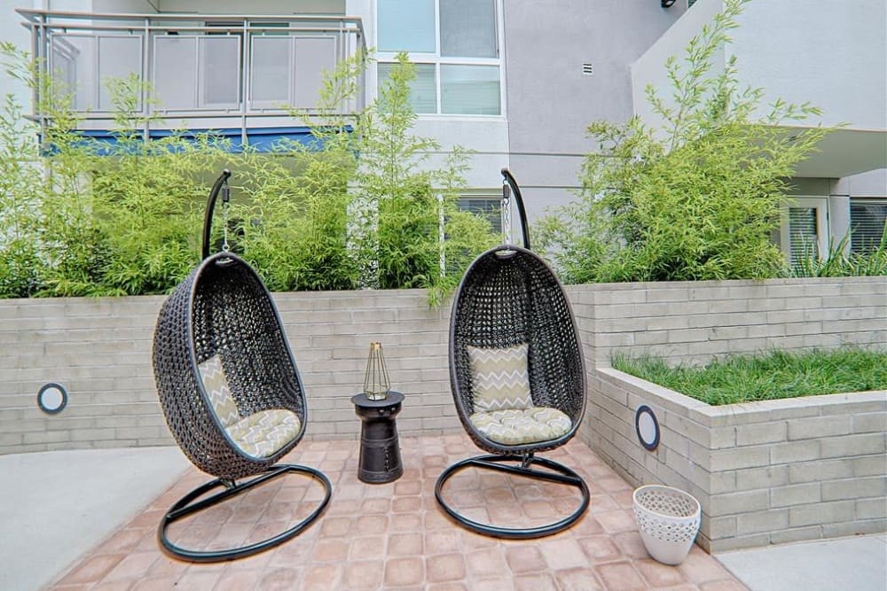 Outdoor garden seating at Angelene Apartments in West Hollywood, California