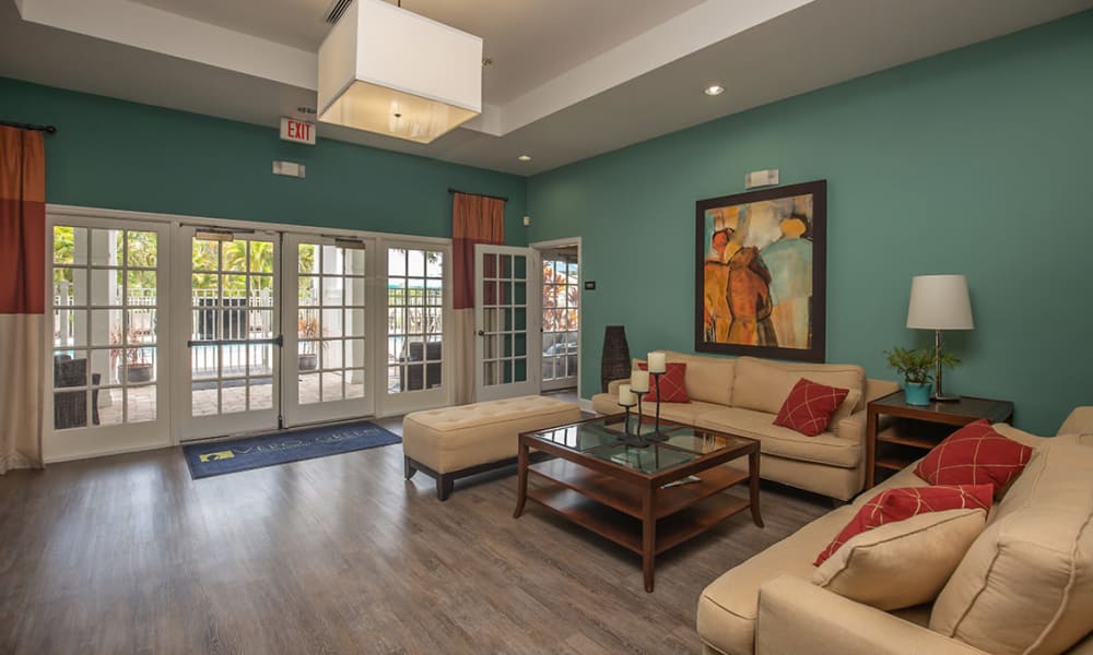 Couches near the double doors leading to the swimming pool at Vero Green in Vero Beach, Florida