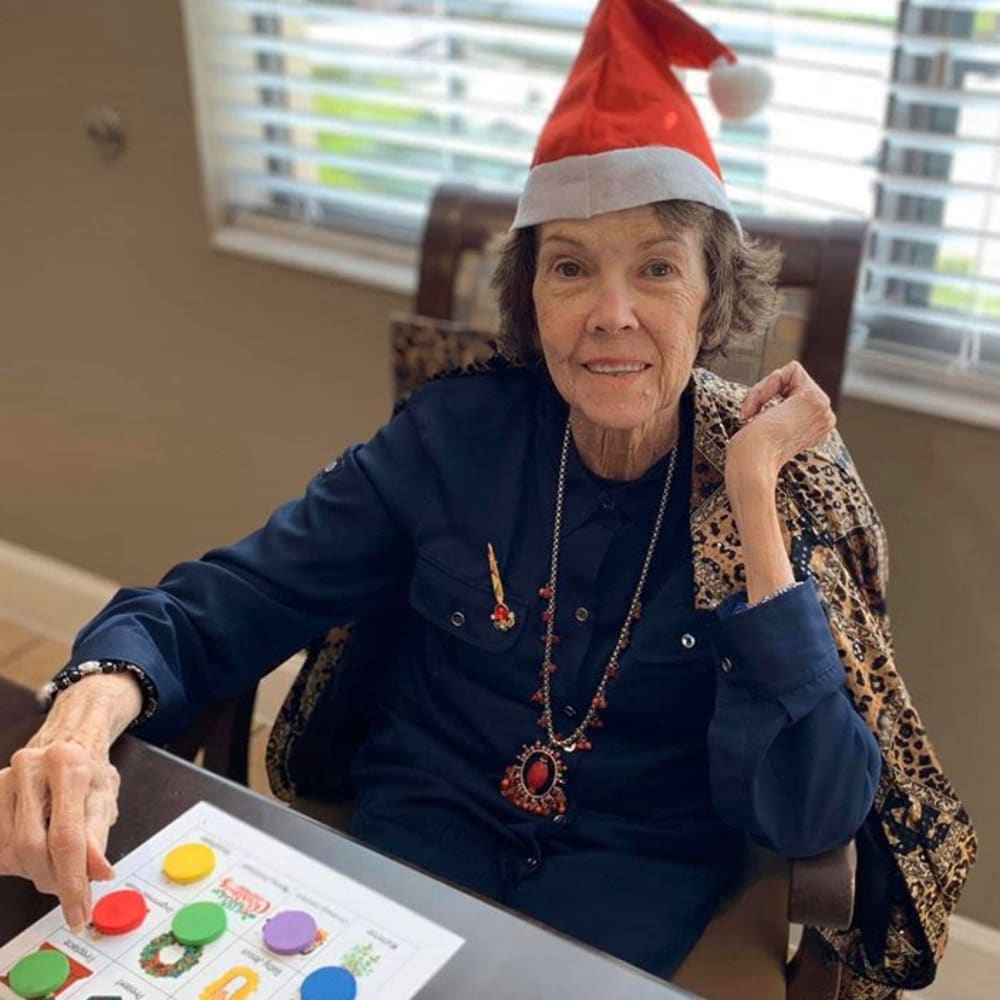 A resident playing a game at Inspired Living Ivy Ridge in St Petersburg, Florida