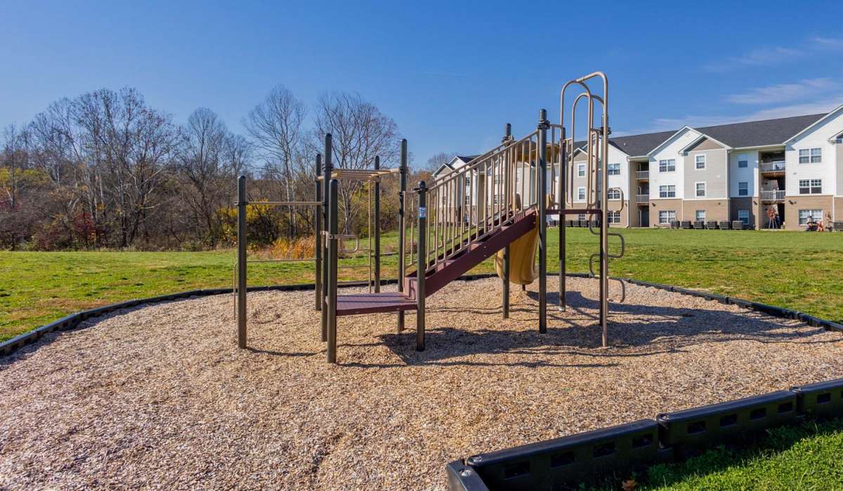 Children's playground with slides and swings at Kershaw Greene III in Athens, Ohio