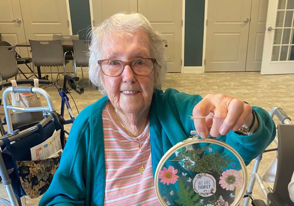 Resident with craft piece at Merrill Gardens at West Chester in West Chester, Pennsylvania