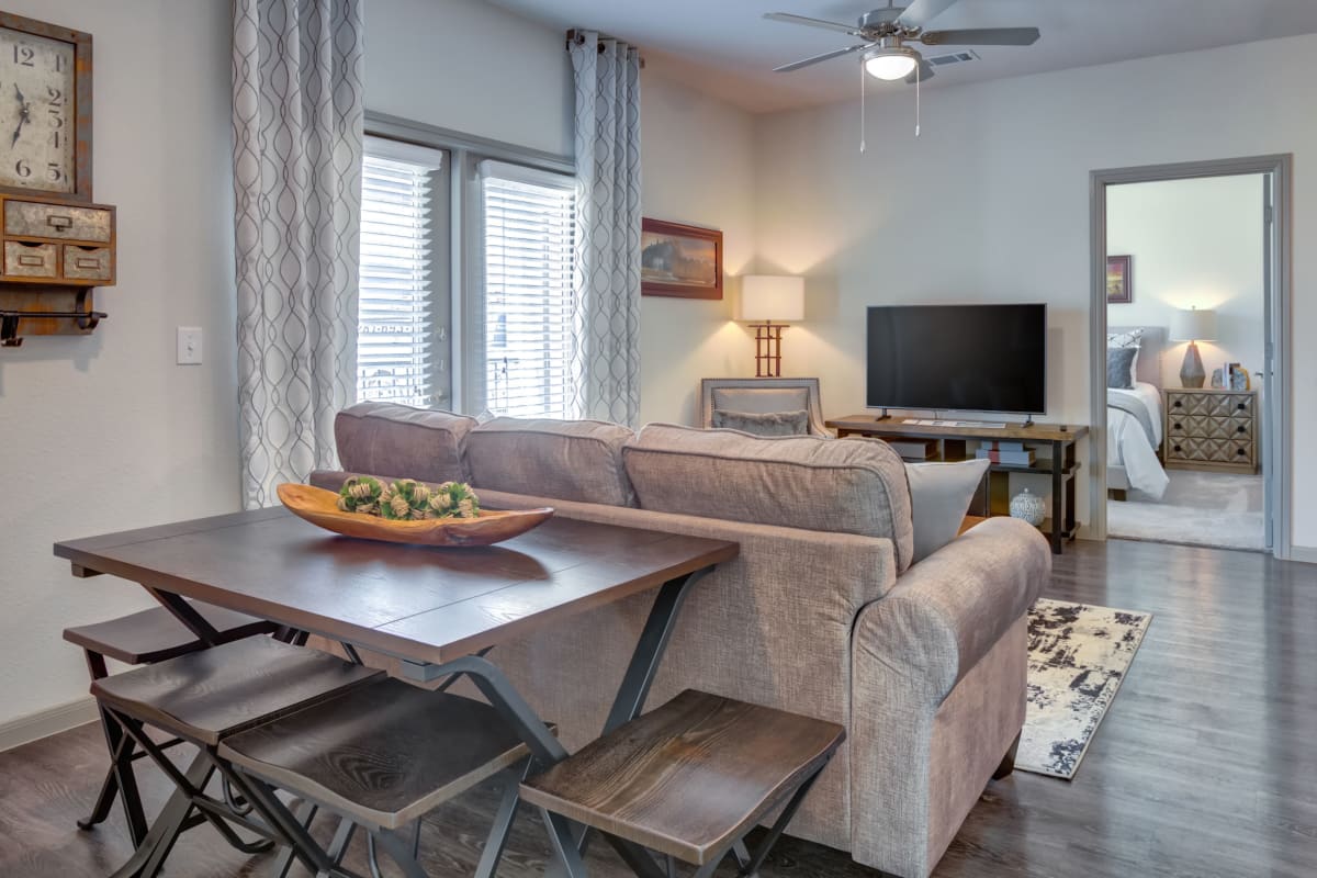 Wood-style flooring in an apartment living room at Williamson at the Overlook in Georgetown, Texas