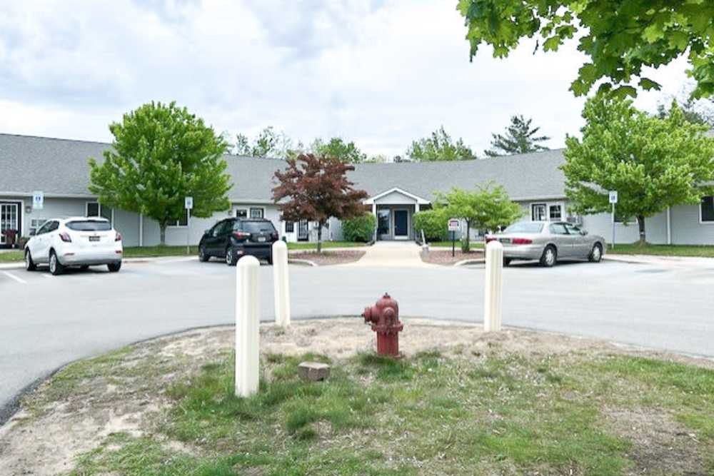 Exterior view of an apartment at Whispering Pines in Grayling, Michigan