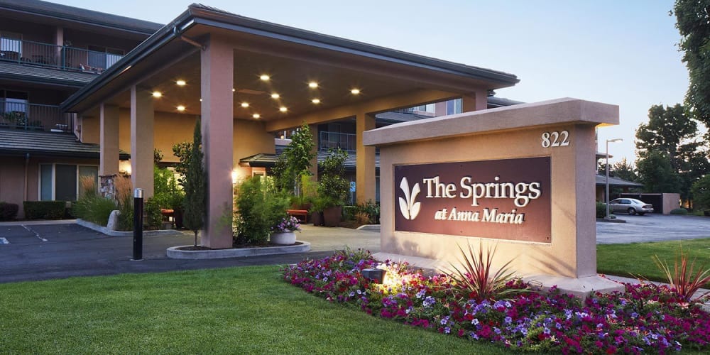 Inviting patio with a pond and lots of plantlife around at The Springs at Anna Maria in Medford, Oregon