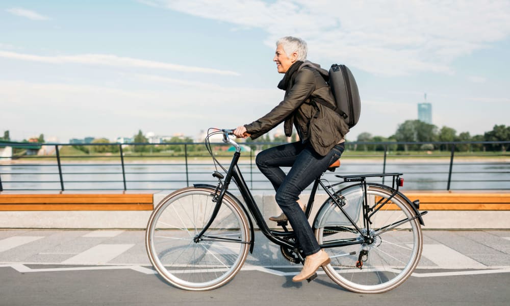 Resident going for a bike ride near Harbor Oaks Apartments in Sacramento, California