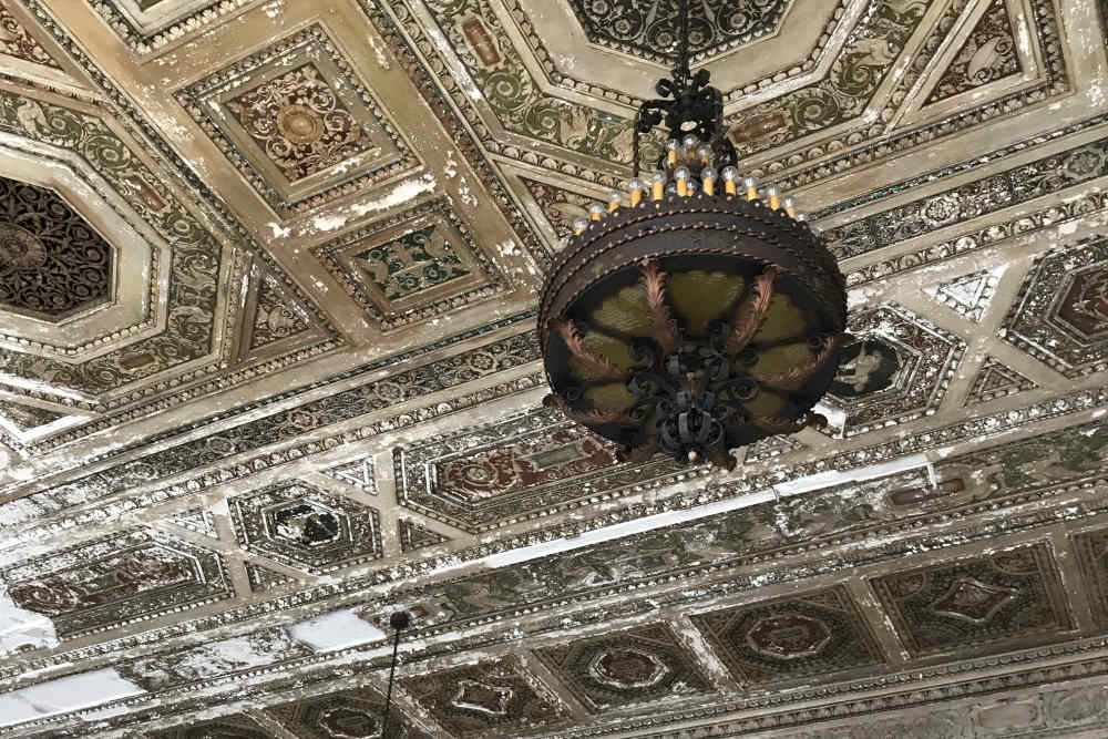 Intricate vintage ceiling with ornate details at 43 Town Square in Lima, Ohio