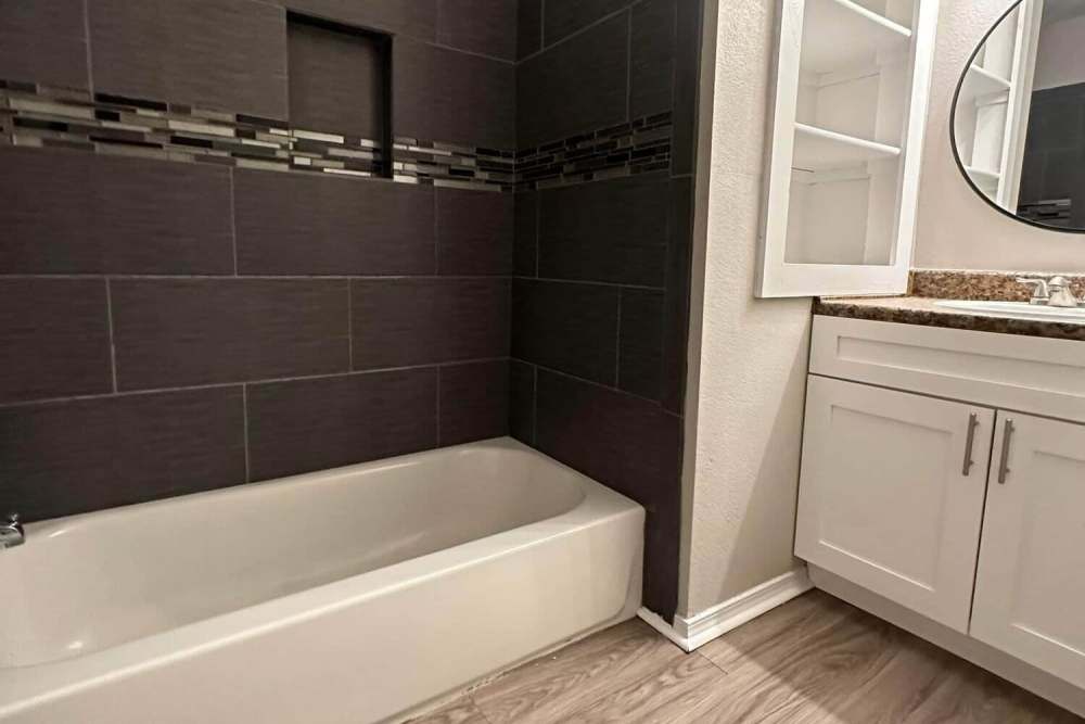 Bathroom with sink and bathtub at Lake Hefner Townhomes in Oklahoma City, Oklahoma