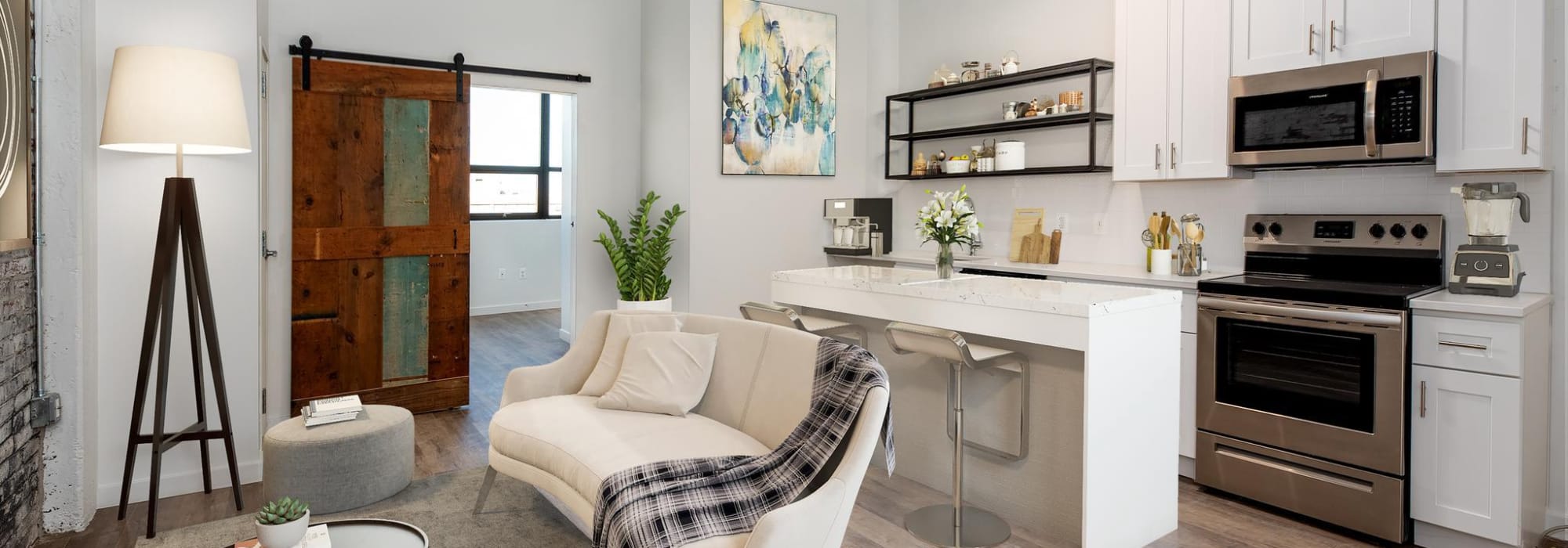 Kitchen and living room at Brush Factory Lofts in Philadelphia, Pennsylvania 