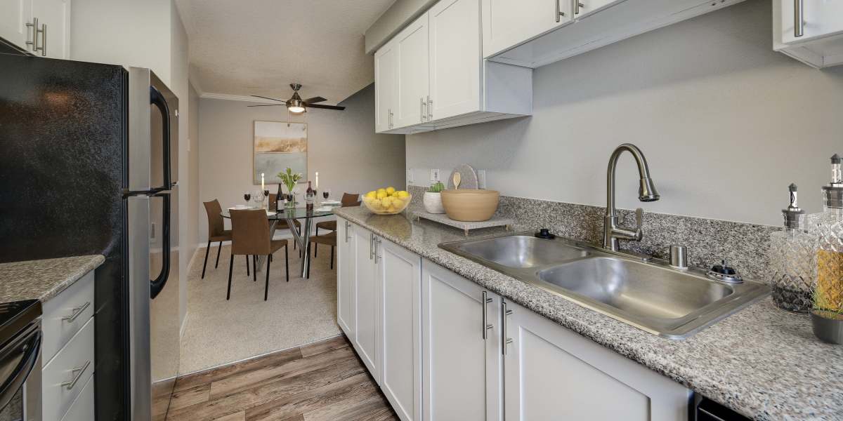 A kitchen with plenty of cabinet space at Walnut Grove Landing Apartments in Vancouver, Washington