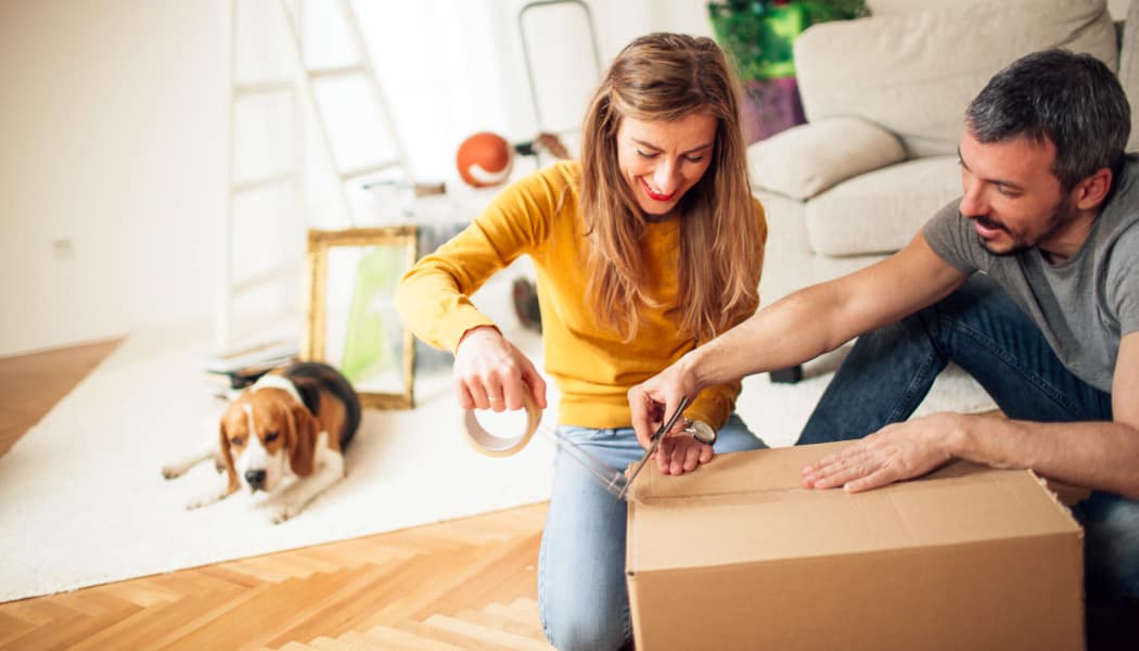Happy couple packing their belongings to store them at a Storage Star location