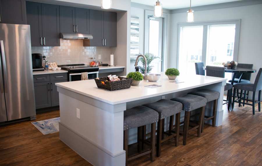Modern kitchen with marble countertops at The Bammel in Houston, Texas