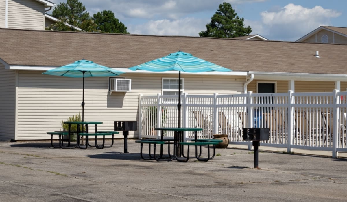 Covered picnic tables by the swimming pool at Ivy Green at the Shoals in Florence, Alabama