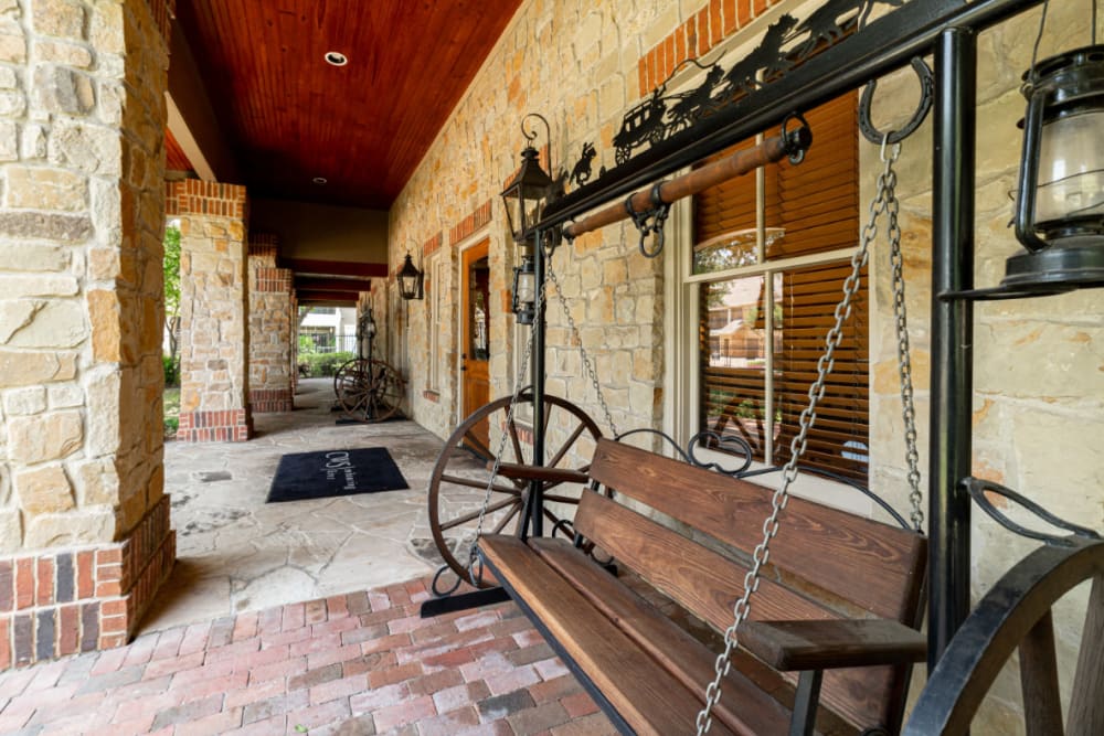 Antique swing bench outside main entrance of Marquis at Bellaire Ranch in Fort Worth, Texas