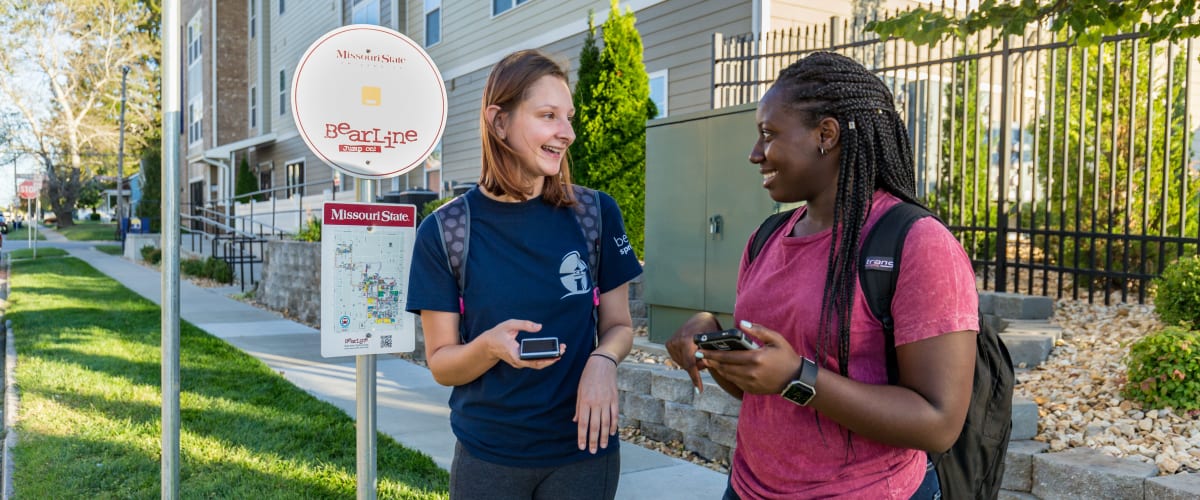 Residents waiting for the bus to go downtown at Beacon Springfield in Springfield, Missouri