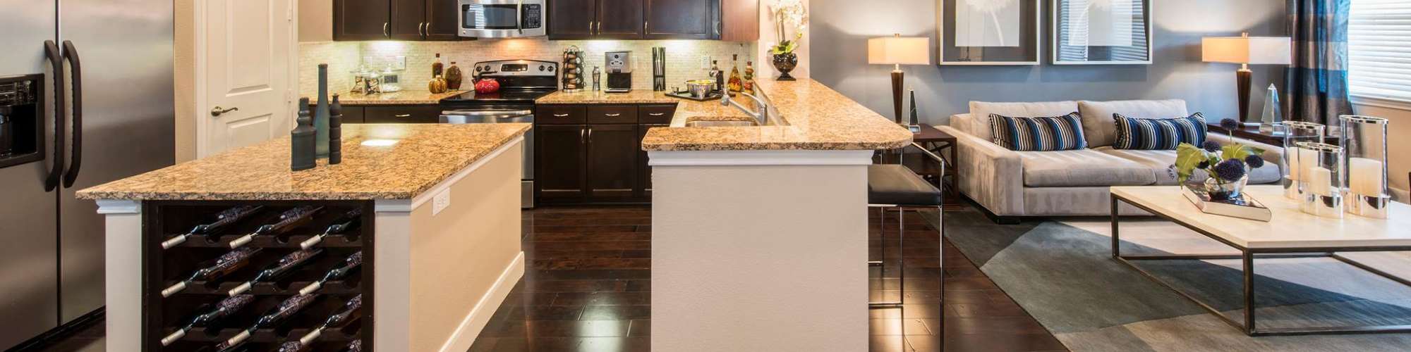 Kitchen room with access to living room at Floor Plans | Perry Row in Dallas, Texas