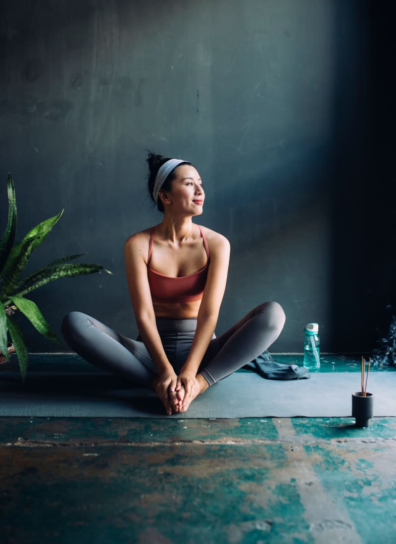 Resident doing yoga at Marquis at the Reserve in Katy, Texas