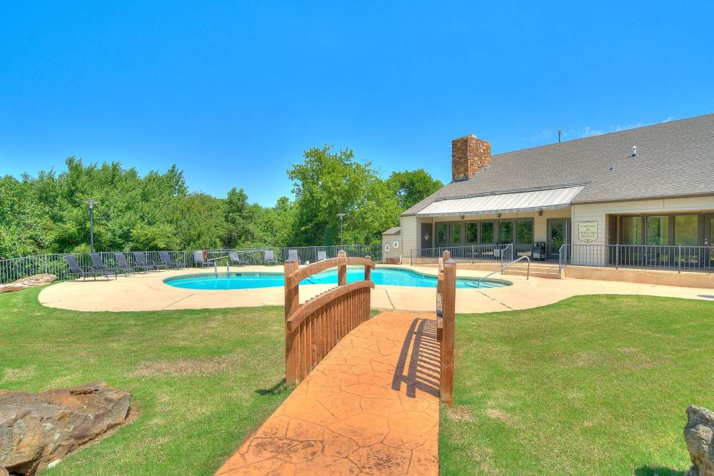 Swimming pool with green lawn at Stonebrook in Oklahoma City, Oklahoma
