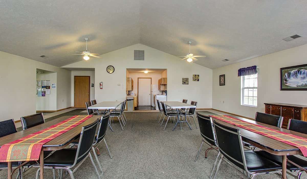 Tables with chairs and decorative table runners at Wellington Place in Ottawa, Ohio