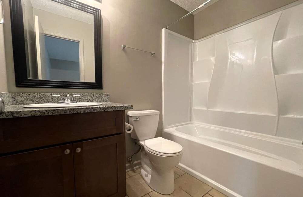 Apartment bathroom with wash tub at Creekwood Townhomes in Hammond, Louisiana