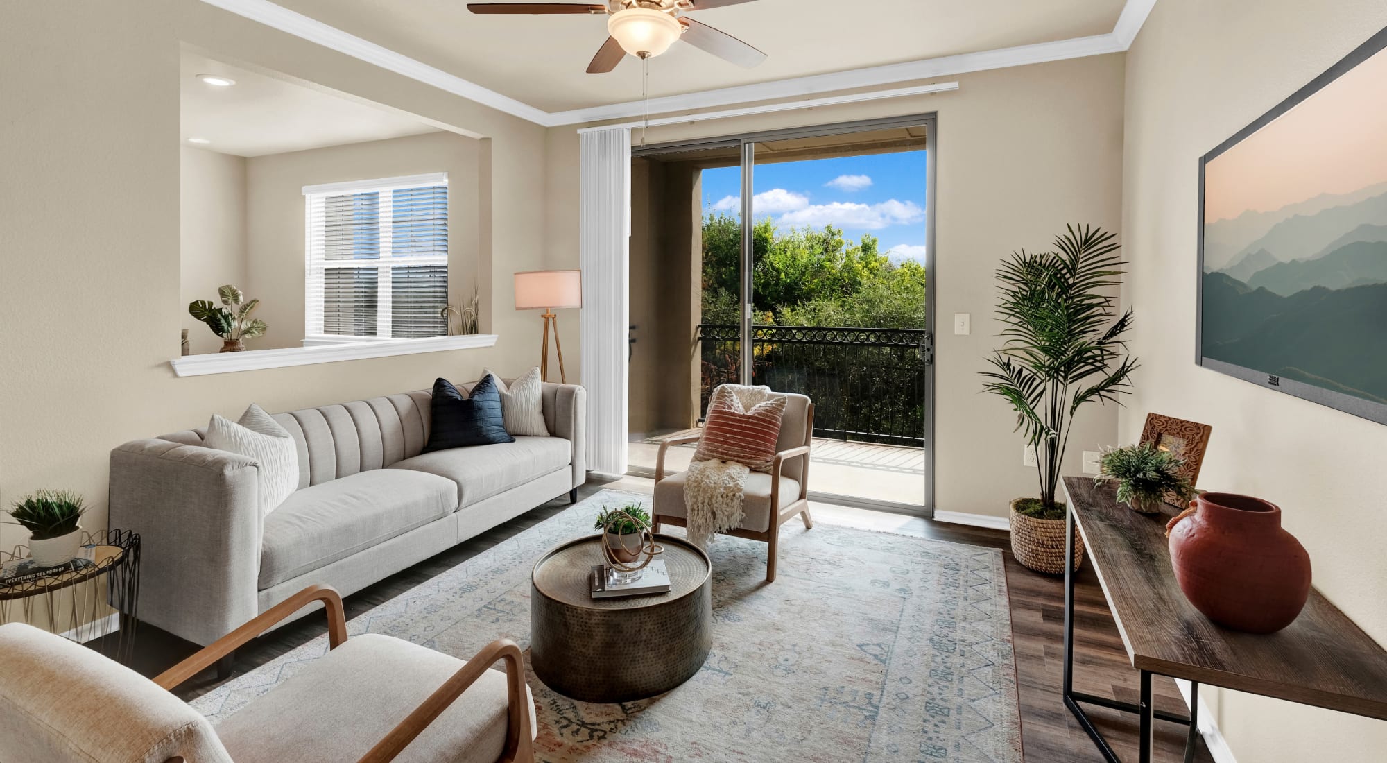 Living room with ceiling fan at Villas of Vista Del Norte