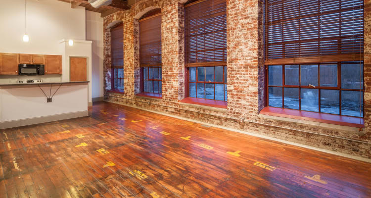 Model living room and kitchen at Porterdale Mill Lofts in Porterdale, Georgia