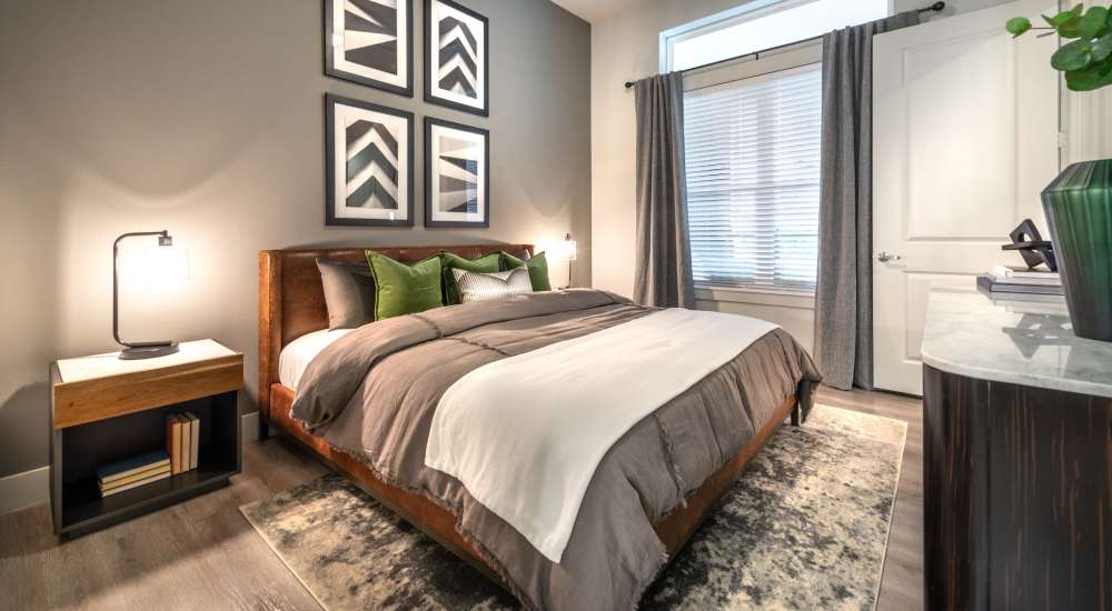Cozy bedroom with a large bedat Cornell Midtown in Dallas, Texas