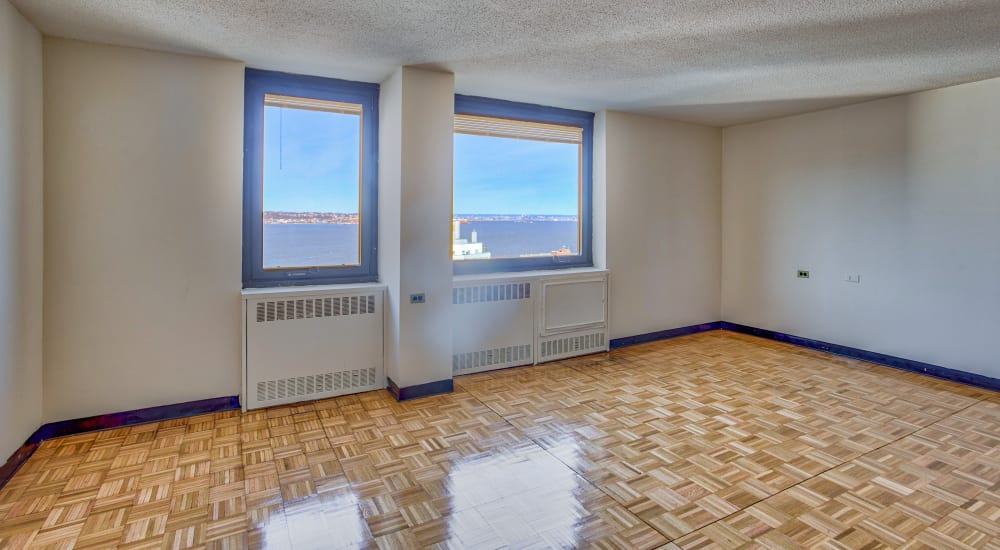 Living space with wall-to-wall carpeting and leather seating at Shore Hill in Brooklyn, New York